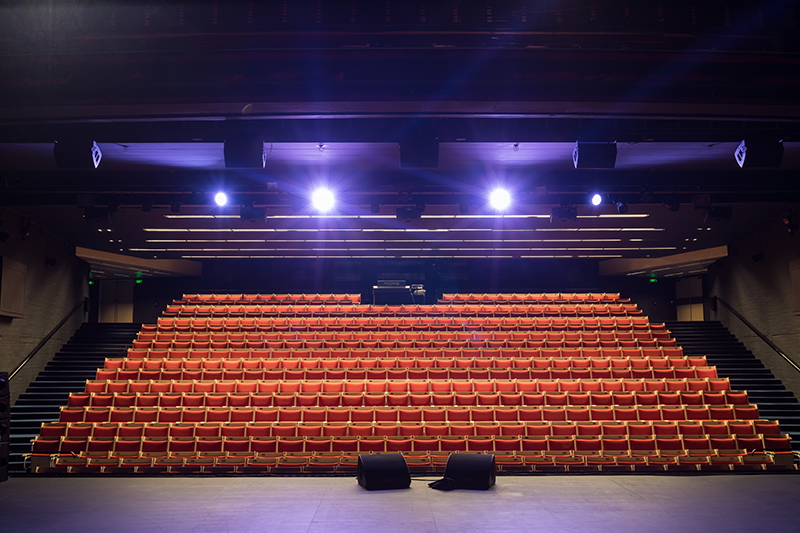 A photo of the empty Drama Theatre at Sydney Opera House, rows of chairs photographed from the perspective of someone standing on stage.