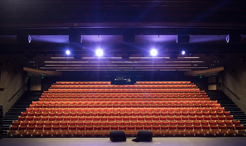 A photo of the empty Drama Theatre at Sydney Opera House, rows of chairs photographed from the perspective of someone standing on stage.